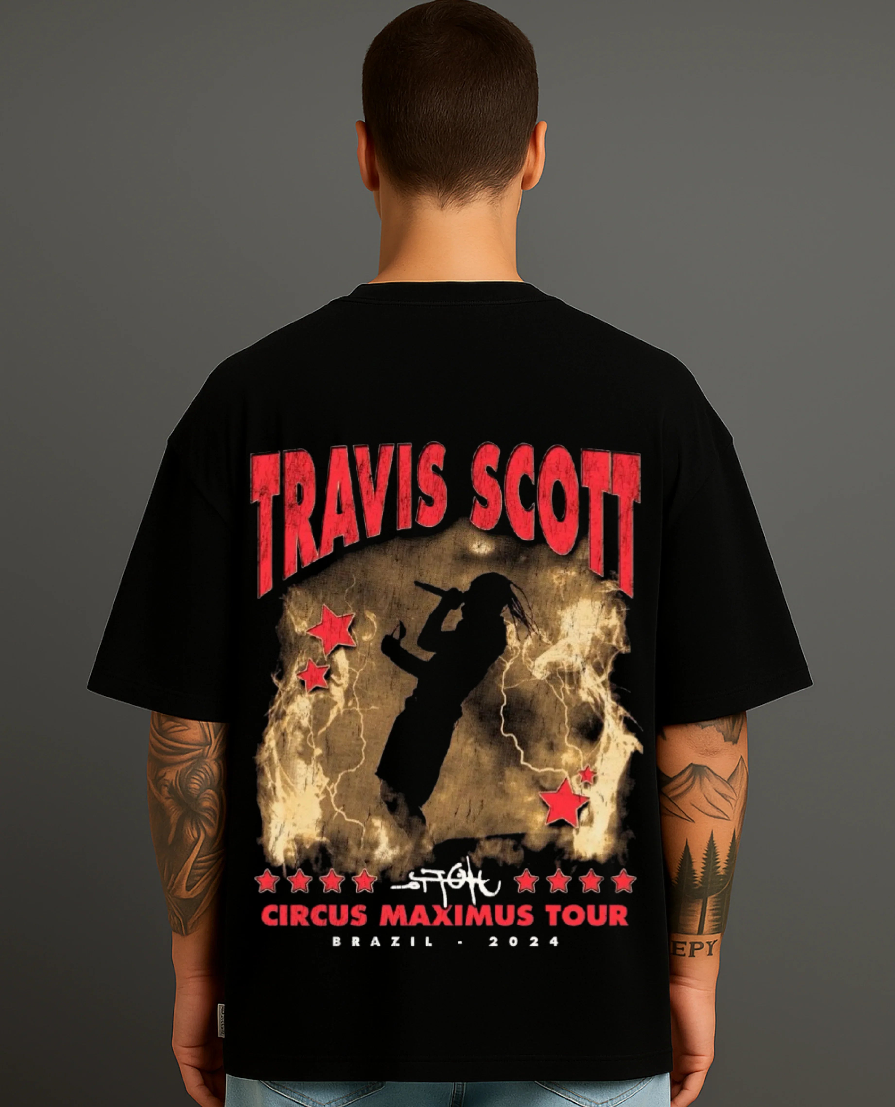 Back view of man wearing ATRAYE black streetwear T-shirt with bold tour print design.