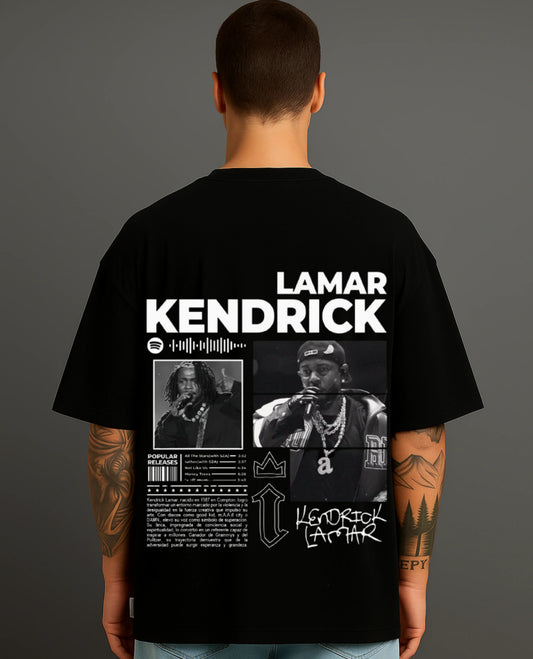 Man wearing black ATRAYE streetwear T-shirt with bold 'Lamar Kendrick' graphic and artist photos.