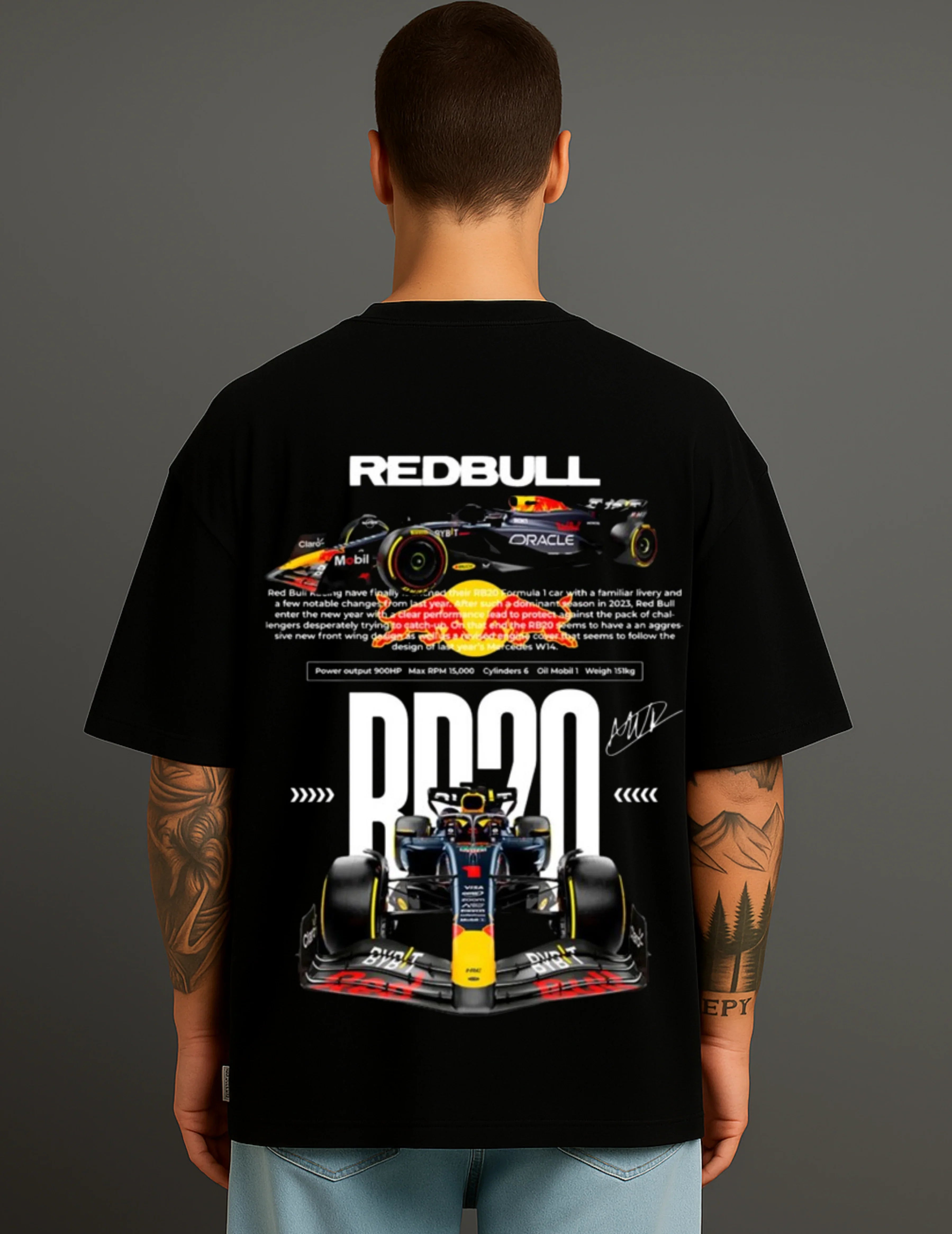 Man wearing ATRAYE black streetwear T-shirt with Red Bull Formula 1 car graphic and racing text.
