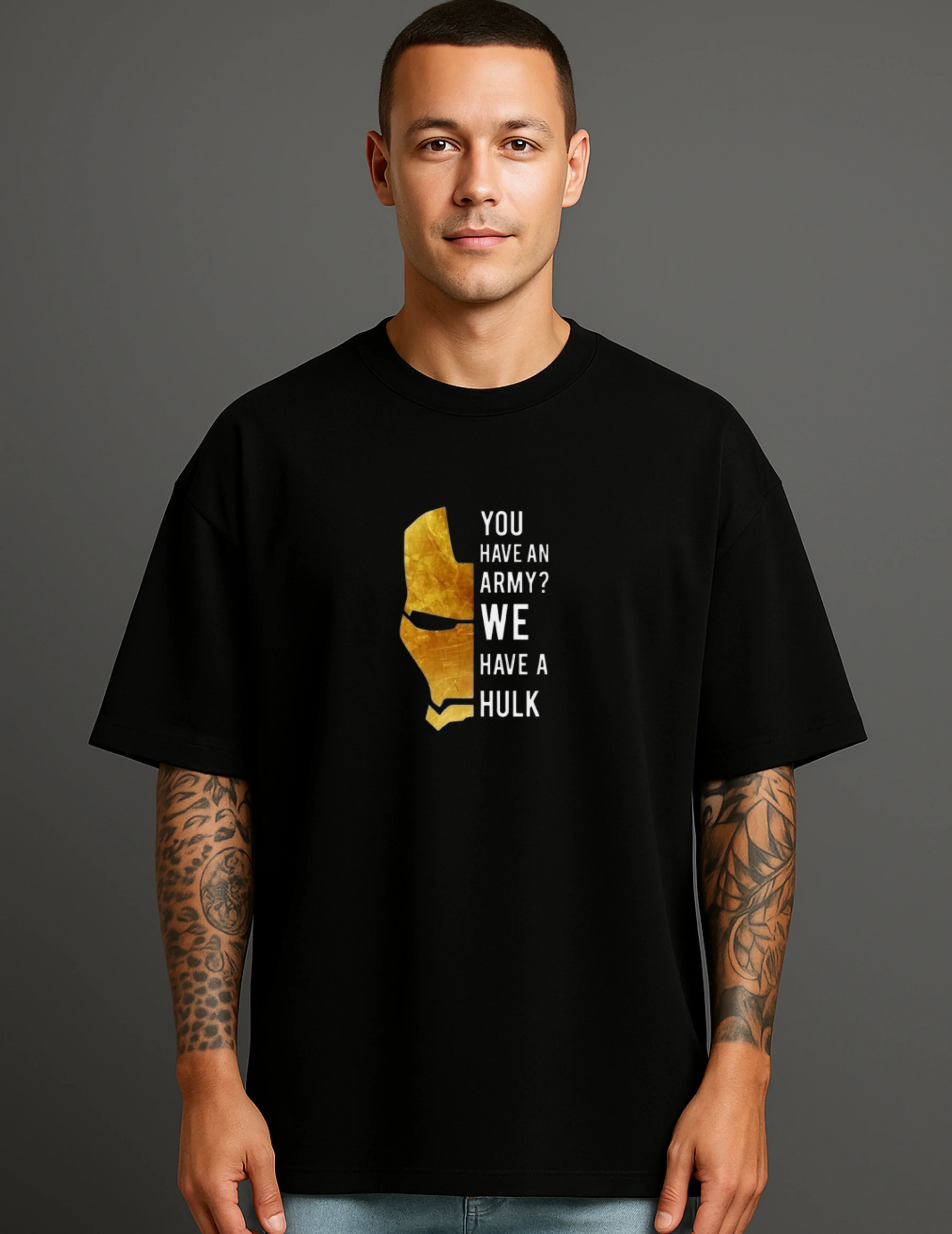 Man wearing ATRAYE streetwear black T-shirt with gold helmet graphic and 'You have an army? We have a Hulk' text.