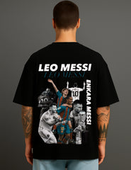 Man wearing black ATRAYE streetwear T-shirt with Leo Messi graphic collage and bold text.