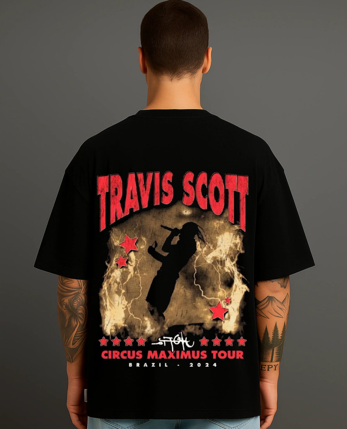 Back view of man wearing ATRAYE black streetwear T-shirt with bold tour print design.