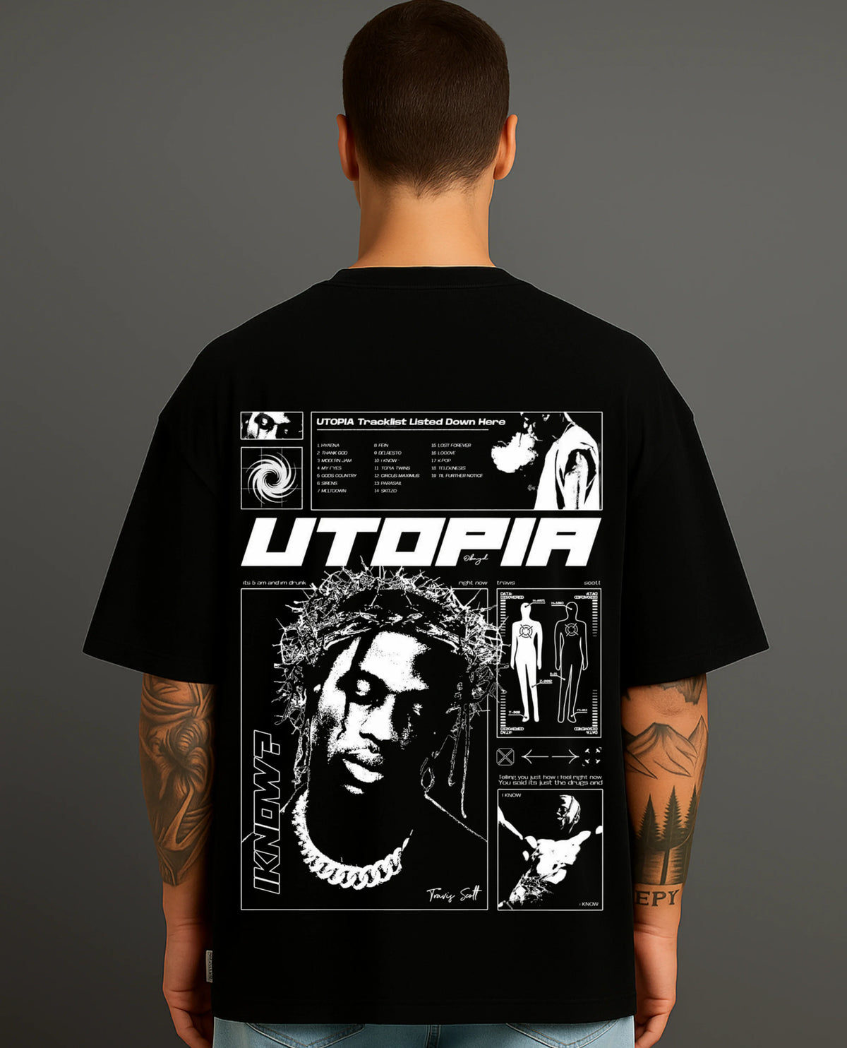 Man wearing black ATRAYE streetwear T-shirt with bold Utopia graphic print on back