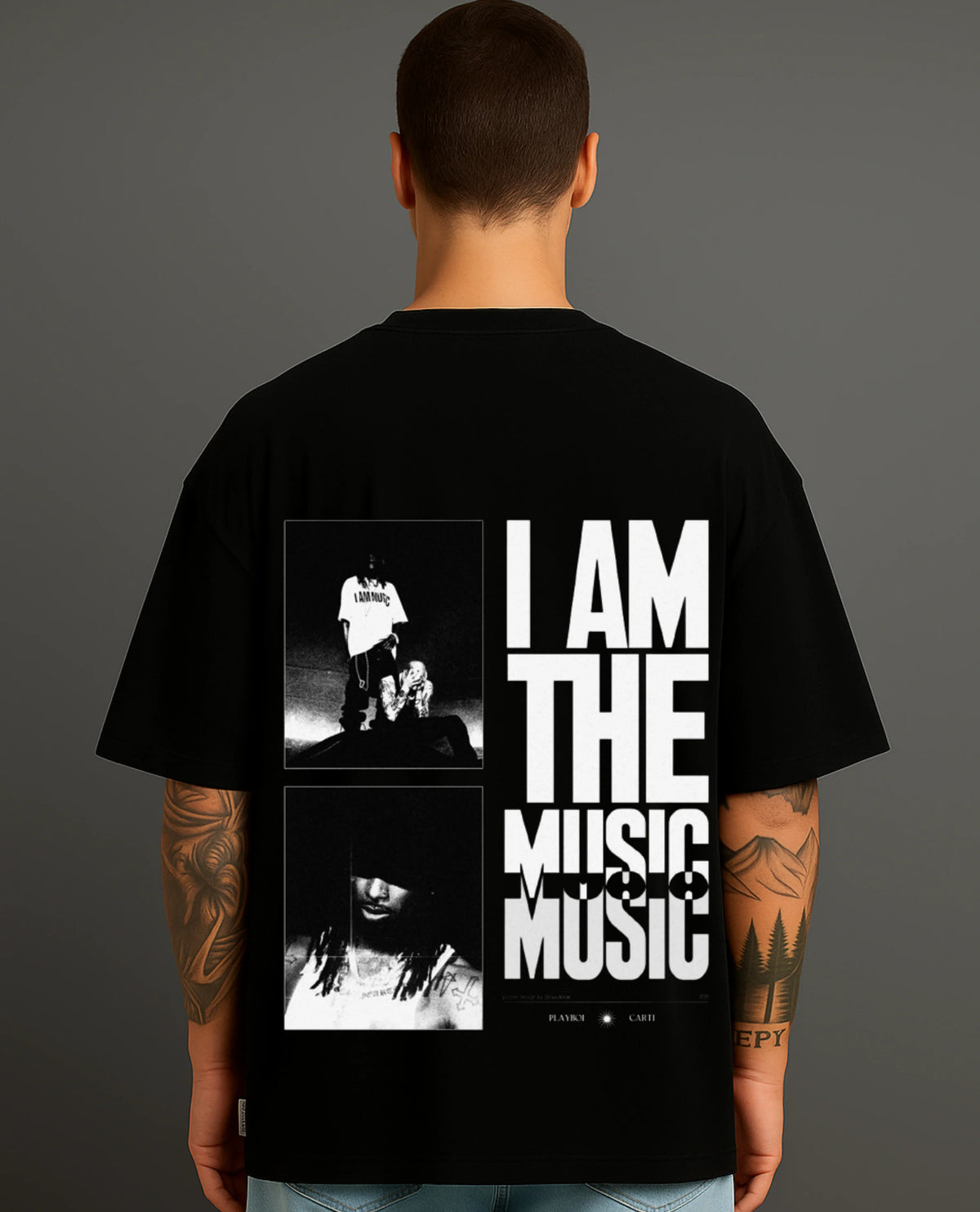 Man wearing Atraye black streetwear T-shirt with bold 'I AM THE MUSIC' graphic and musician photos.