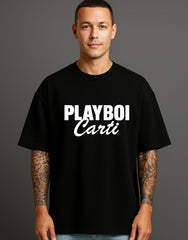 Man modeling black streetwear t-shirt with bold PLAYBOI Carti print, ATRAYE style