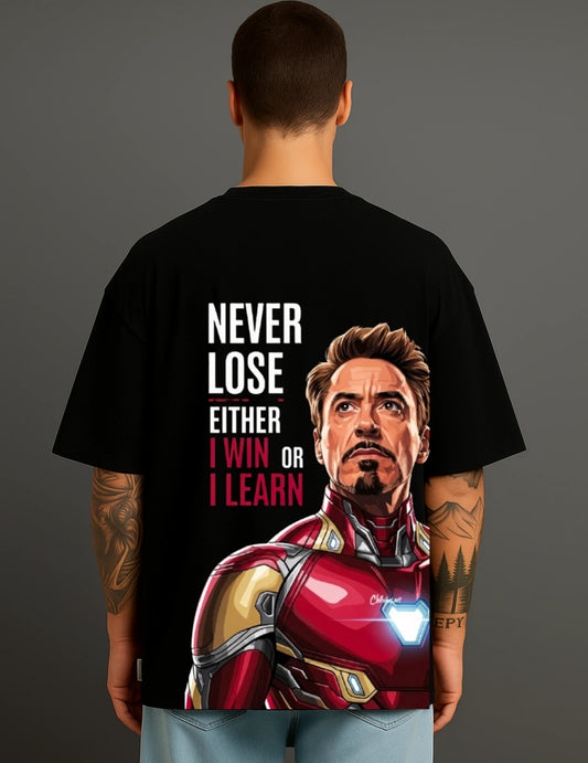 Man wearing black ATRAYE streetwear T-shirt with Iron Man graphic and inspirational quote