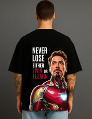Man wearing black ATRAYE streetwear T-shirt with Iron Man graphic and inspirational quote