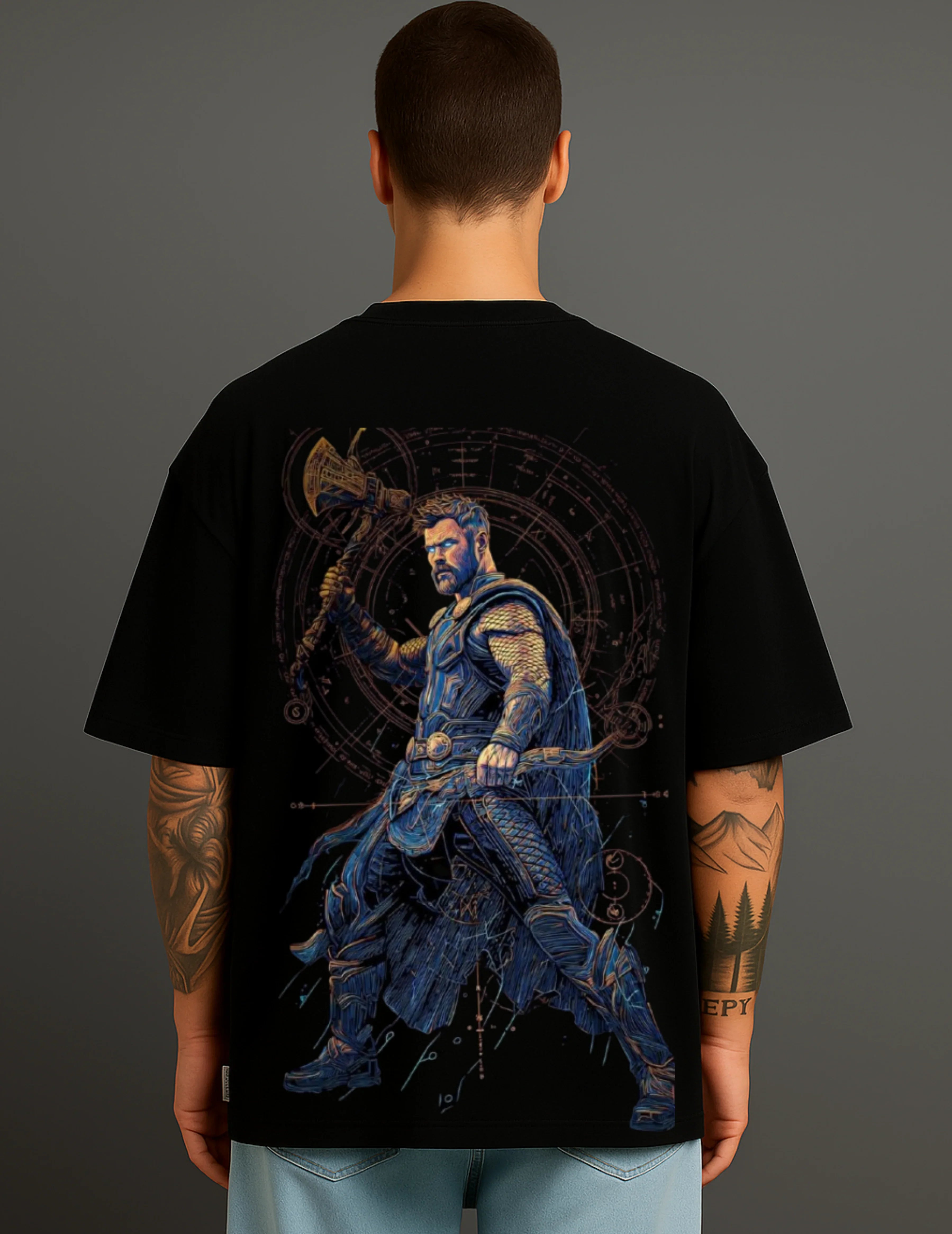 Man wearing ATRAYE streetwear T-shirt with a bold warrior graphic on black fabric
