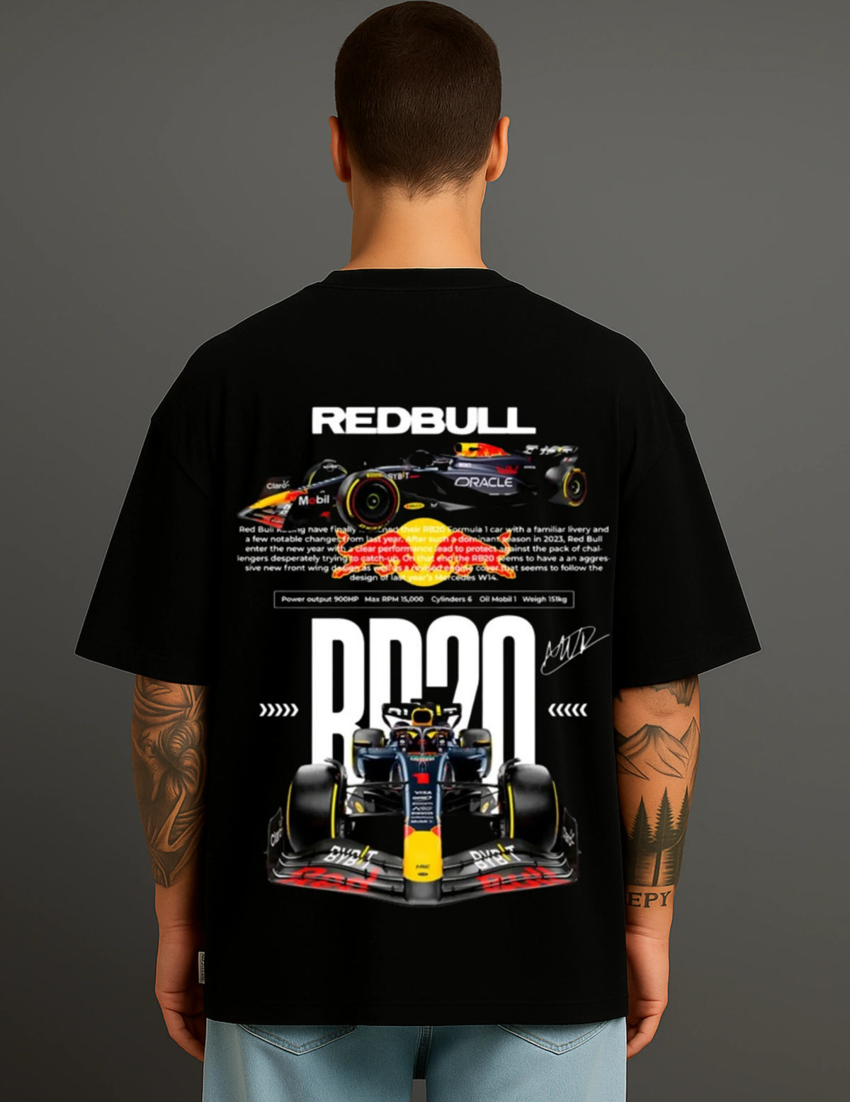 Man wearing ATRAYE black streetwear T-shirt with Red Bull Formula 1 car graphic and racing text.