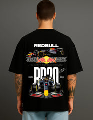 Man wearing ATRAYE black streetwear T-shirt with Red Bull Formula 1 car graphic and racing text.