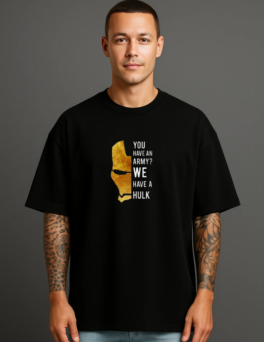 Man wearing ATRAYE streetwear black T-shirt with gold helmet graphic and 'You have an army? We have a Hulk' text.