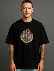 Man wearing black ATRAYE streetwear T-shirt with bold printed 'Infinite Power' graphic