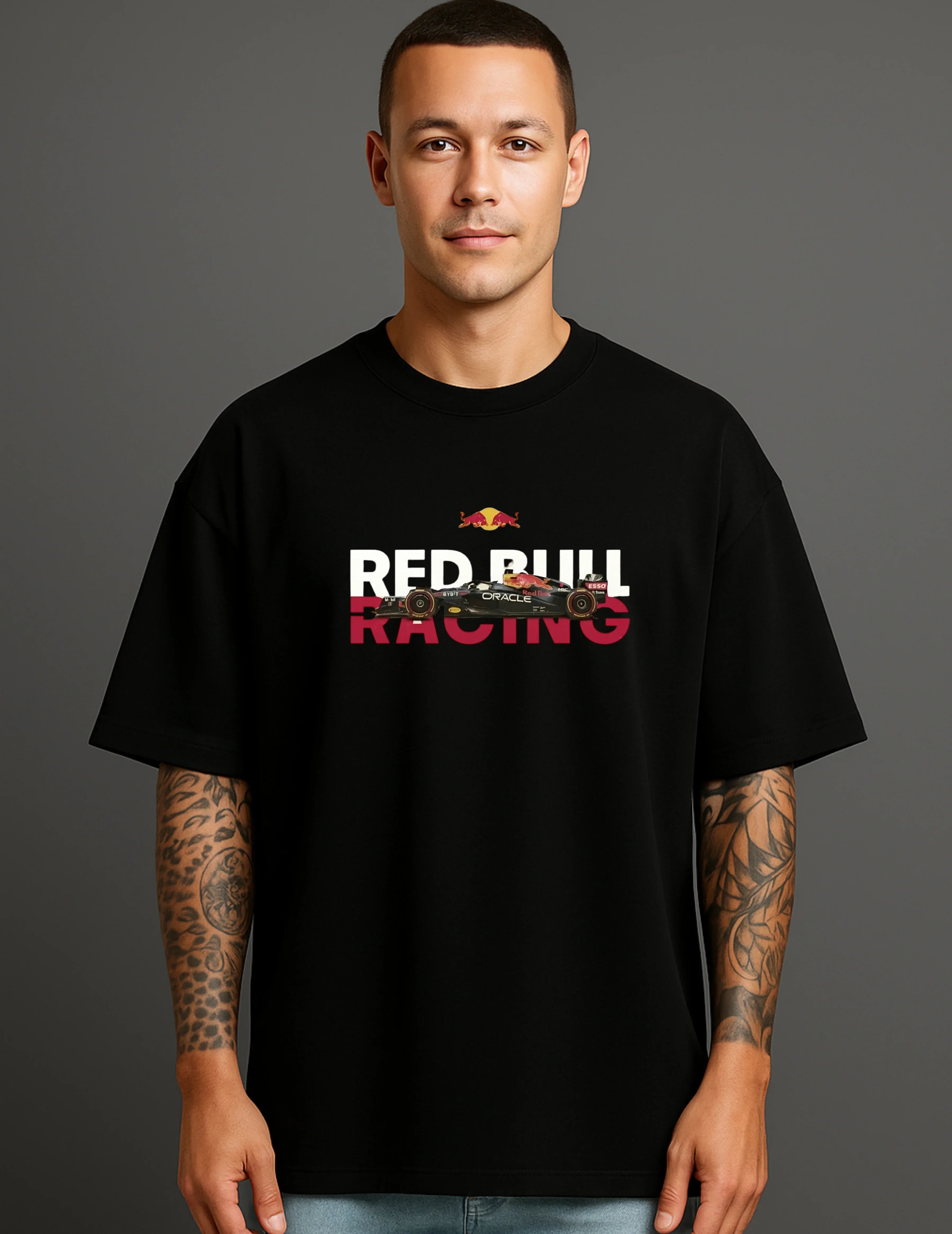 Man in black oversized streetwear T-shirt with Red Bull Racing car graphic, ATRAYE style