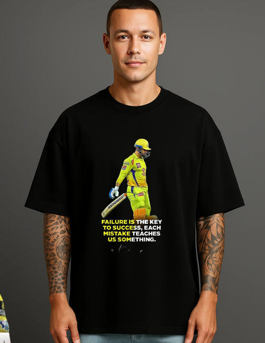 Man in black ATRAYE T-shirt with motivational cricket graphic and quote, streetwear fashion